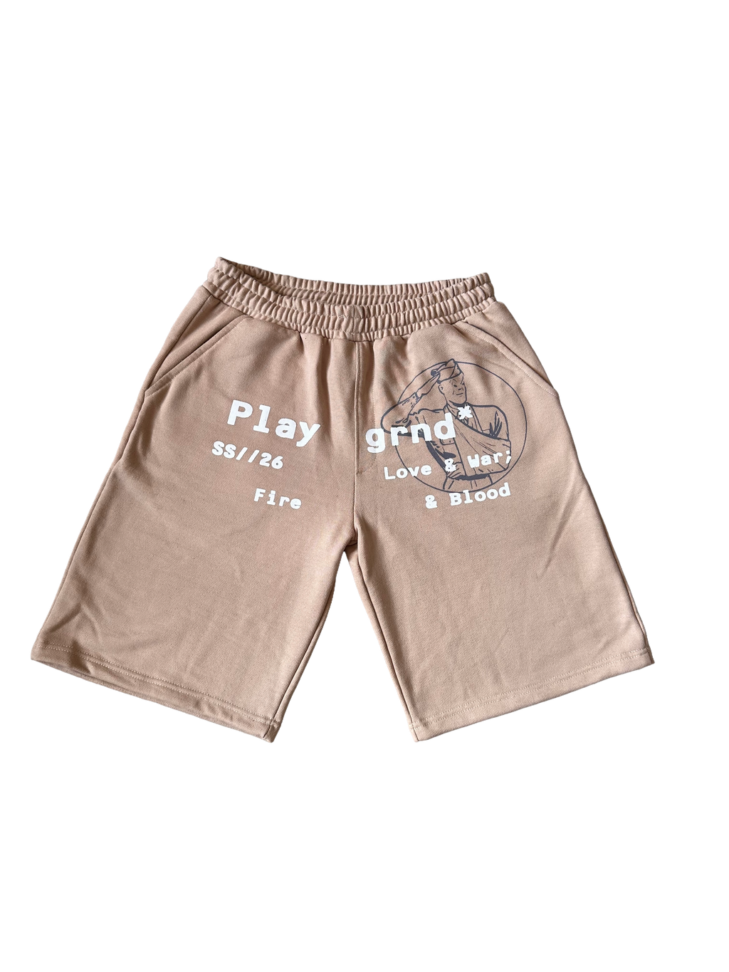 A pair of beige athletic shorts with a gray graphic print on the left leg and white text on the right leg, displayed flat against a white background.